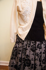 Black velvet cheery rose pattern on vintage 50s skirt with fringed hem.