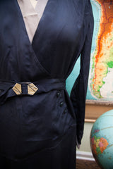 Navy 1920s day dress waist with Art Deco belt buckle and three side buttons.