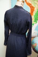 Rear view of vintage 1920s Navy Blue Day Dress with Art Deco belt and shoulder rips.