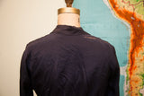 Vintage 1920s navy blue day dress back, with visible rips and striations on the shoulder.