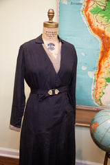 Art Deco belt, geometric paneled skirt, and pleats on vintage 1920s navy day dress.