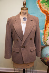 Vintage Guy Laroche wool blazer with brown buttons, double-breasted design, and herringbone texture.