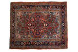 Vintage fine Heriz square rug with a scalloped floral medallion in brick red, navy, and powder blue.