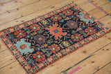 Antique Senneh rug corner: navy, madder root red Harshang motifs, subtle abrash, fine weave.