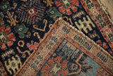Corner of antique Senneh rug with fine weave, showing back foundation and re-wrapped selvage.
