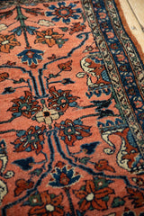 Textured hand-knotted pile of a Lilihan rug with floral details in dusty teal and sapphire blue.