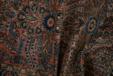 Textured pile of a vintage Persian Lilihan rug with intricate dusty rose and navy blue design.