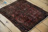 Intact side cord selvage and navy blue border of a fine vintage Persian Sarouk rug.