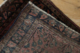 Hand-knotted reverse weave and original side cord selvage of a vintage Sarouk rug mat.