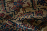 Antique Lilihan hand-knotted rug detail: dusty rose and sapphire blue interlaced vines on unusual beige.