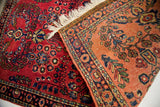 Vintage Sarouk Persian rug detail highlighting rich red and soft peach color variation.