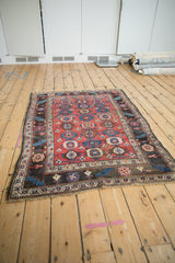 Full perspective of an antique Kurdish Bijar rug, highlighting its gem-toned Veramin design.