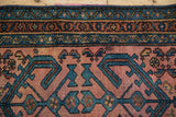 Antique Persian Mehriban rug with dusty raspberry field, sapphire blue geometric floral vines.