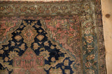 Antique Malayer rug corner detail: fine weave, floral borders in dusty blush and muted greens, tattered fringe.