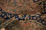 Antique Persian Malayer rug with navy geometric border and fine weave dusty blush field.