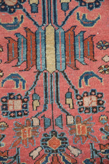 Vintage Mehriban rug's traditional Persian pattern detail in raspberry red and blue.
