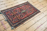 Corner detail of Vintage Mehriban rug with tattered fringe and minor border loss.