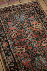 Close-up of Vintage Lilihan rug, with classic Sarouk style floral blossoms in blush.