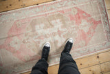 A top-down view of the vintage Oushak rug runner showcasing its distressed texture and scale.