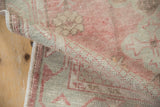 The soft, hand-knotted texture and low pile of a distressed vintage Oushak runner.