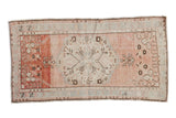 Distressed Oushak rug, abrashed blush field, roundel medallion, and floral motifs, 2'6