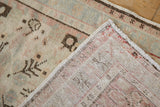 Hand-knotted foundation on the reverse of this distressed Oushak rug, showing soft rose tones.