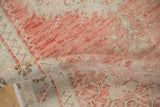 Evenly worn, low-pile texture of a vintage Oushak runner in soft blush and beige.
