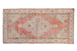 Distressed vintage Oushak runner, faded red field, central shield medallion, blue floral accents, 2'9