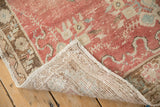 Hand-knotted foundation and intact side selvage on the corner of a vintage Oushak rug.