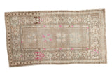 Distressed vintage Oushak rug, geometric serrated floral design, banded border, magenta and pale blue.