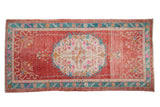 Distressed Oushak runner with raspberry red ground, turquoise border, and pastel floral medallion, 3'3