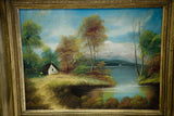 Vintage Cottage on the Lake oil painting in a textured golden frame.