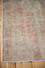 Mostly even wear revealing the hand-knotted texture of the vintage distressed Oushak rug.