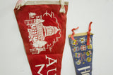 Vintage red felt flag with white capitol building design, blue flag showing provincial crests.