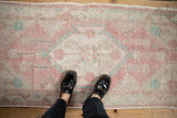 A personal view of the distressed Oushak runner's time-softened texture and faded colors.