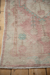 Intact side cord and evenly worn pile of a distressed Turkish Oushak rug runner.
