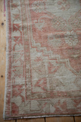 Worn, textured pile and secure side cord selvage on a vintage Oushak rug runner.