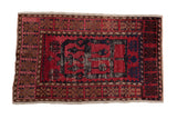 Vintage distressed Oushak rug with a bold dragon motif in navy and black on a faded cochineal red field.
