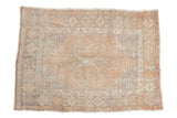 Vintage distressed Oushak rug with a stepped center medallion in pale tangerine and silver tones.