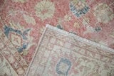 Distressed vintage Sparta carpet: worn dusty blush pile, visible foundation, machine-bound side.