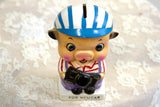 Vintage piggy bank with a hand-painted face, striped helmet, and 'FOR NEW CAR' text.