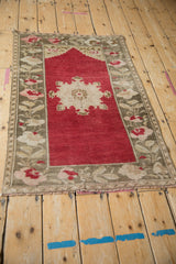 Distressed Oushak prayer rug with cherry red stepped mehrab and floral border.