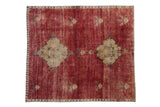 Vintage hand knotted Kars carpet with abrashed cherry red field and double dusty gold medallions, 6' x 6'9