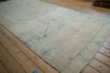 Lengthwise view of the vintage Oushak runner showing its distressed low pile and heavy color abrashes.