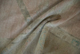Angled view of the vintage Oushak's soft, low pile, worn evenly to the knot heads.