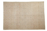 Distressed vintage Oushak carpet with muted trellis and floral palmette patterns in soft pastels.