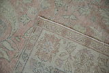 Hand-knotted reverse and machine-finished edge of distressed pink Turkish Sparta carpet.