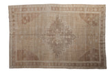 Distressed vintage Oushak carpet, starburst medallion with abrash in muted beige and brown. 6'8
