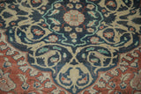 Faded scrolling Islimis and blossom motifs on a distressed vintage Sivas rug in dusty teal and brick red.