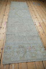 Distressed Turkish hand-knotted rug pile with muted platinum, powder blue, and pale bronze tones.